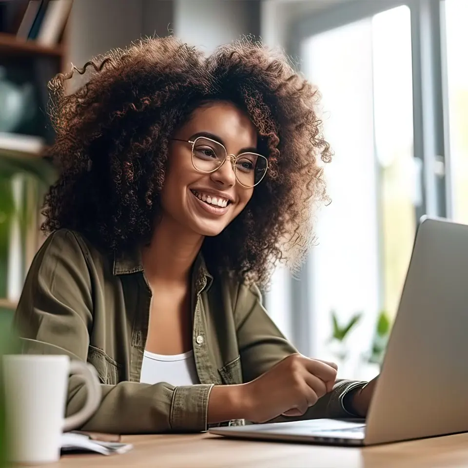 A WD Assist colleague smiling during a call at her laptop