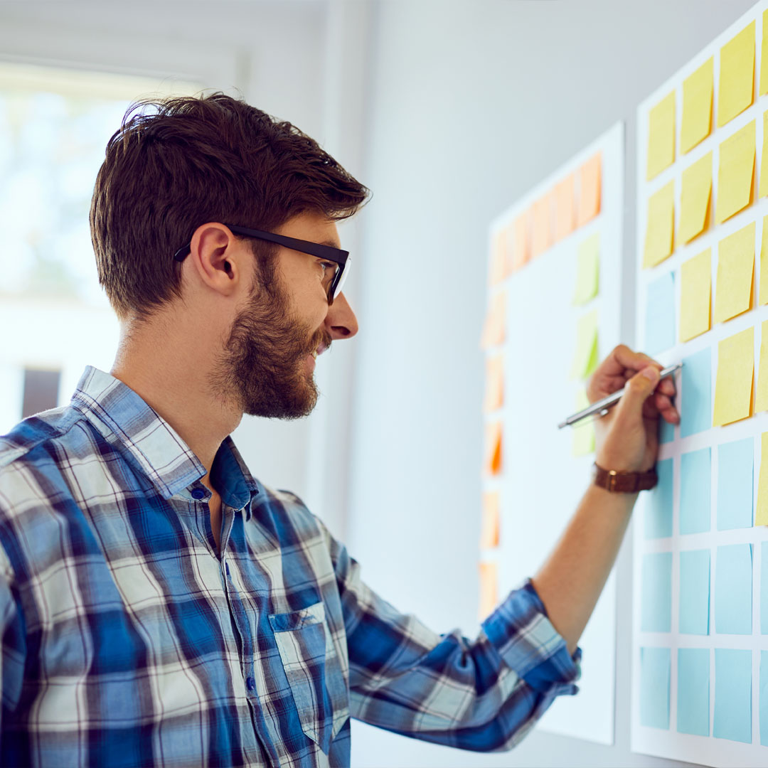 Planning on a wall with post it notes with WD Assist, part of the Cloud Assist Brand